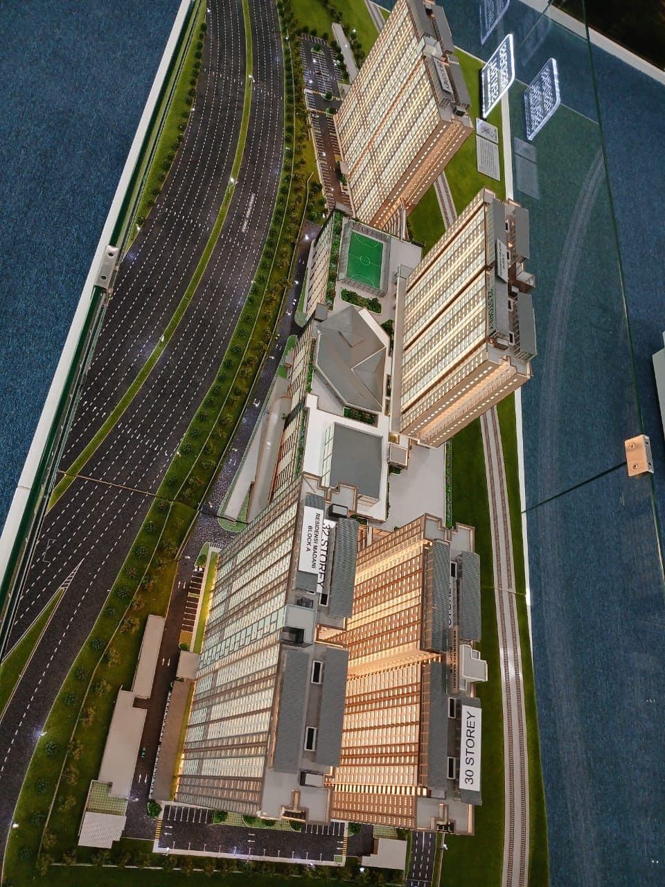 RUMAWIP Residensi Sentral Putrajaya aerial master plan showing four blocks and parking podium