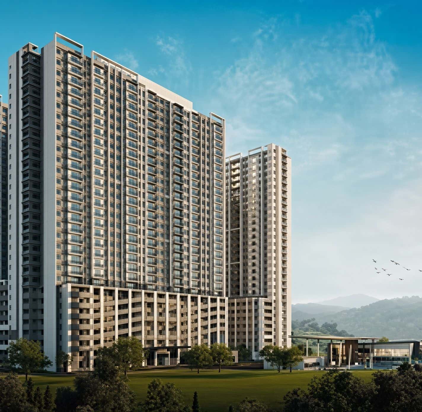 Residensi Alam Sari apartment towers with a landscaped lawn and hills behind